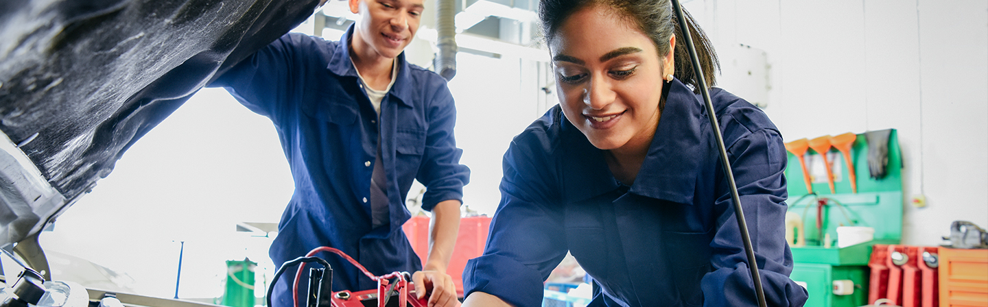 Students fixing a car