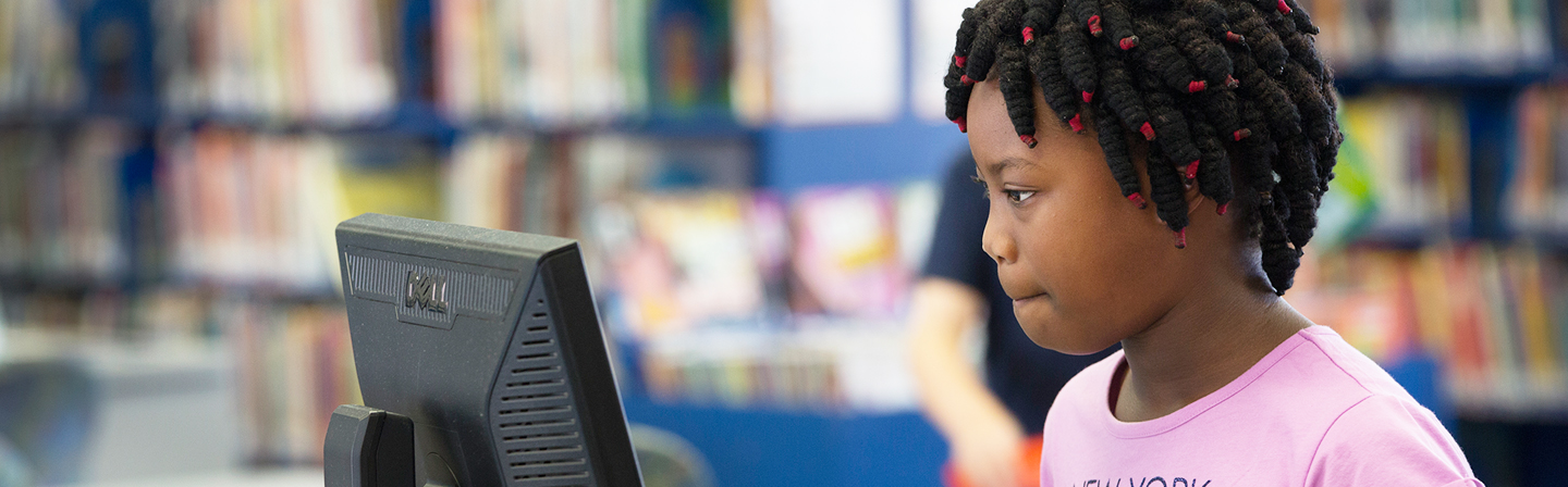 Girl looking at computer